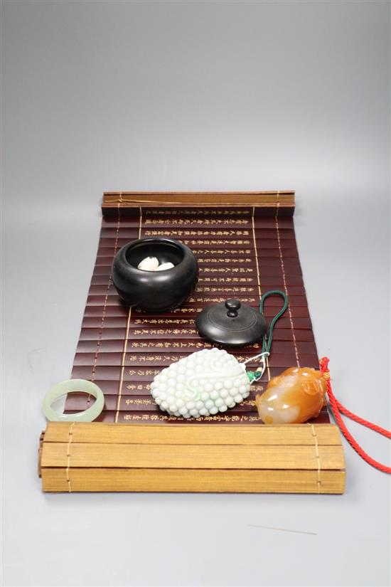 A Chinese jadeite carving, a chalcedony carving and a slatted bamboo scroll, etc.